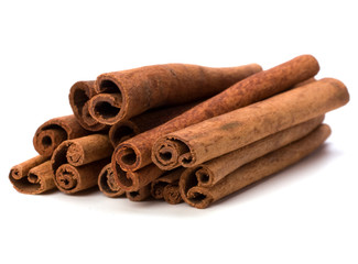Cinnamon sticks isolated on white background .