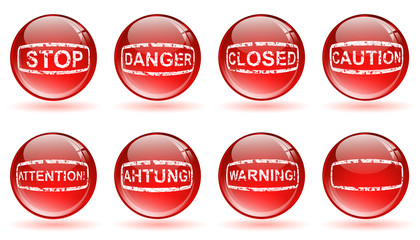 glossy balls with warning signs