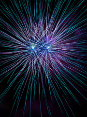 Fototapeta premium Long Exposure of Fireworks Against a Black Sky