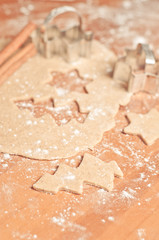 Christmas baking background: dough, cookie cutters and spices