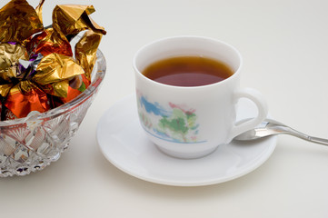 Chocolate candies and black tea
