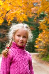 Schoolage girl autumn outdoor portrait