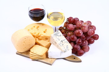 Various types of cheese and red and white wine