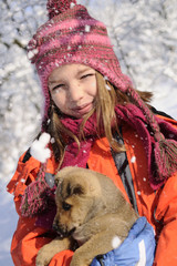 snowing on baby dog and girl