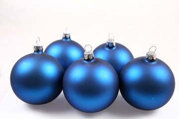 Blue matt christmas balls on white background
