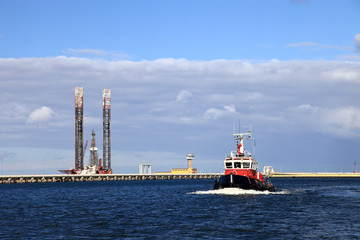 A red fireboat return to port. Gdansk, Poland.