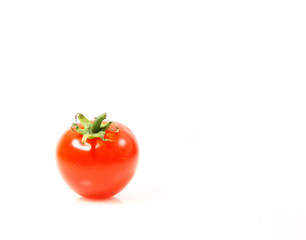 Small tomatoes isolated on white background