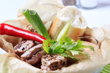 Roast pork tenderloin with roll and sauce