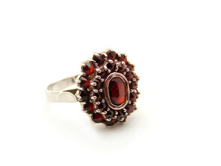 Silver ring with garnet isolated on a white background