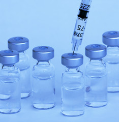 Vials and syringe, tugsten light