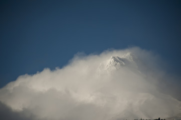 Naklejka na ściany i meble Snowy mountain peak