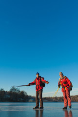 Two scandinavian skaters on a frozen lake