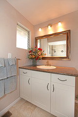 Fototapeta na wymiar Luxury simple white bathroom cabinet and granite