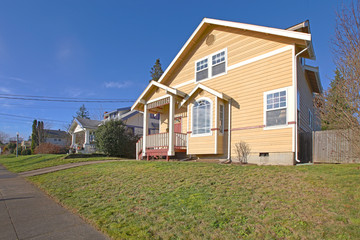 Fototapeta premium Yellow house front and street