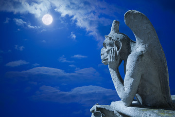Notre Dame: Chimera (Stryge) under the moon of Paris
