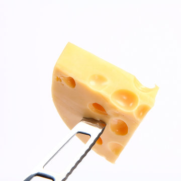 Some cheese on a cheese knife
