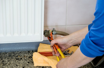 hands of a plumber repairman
