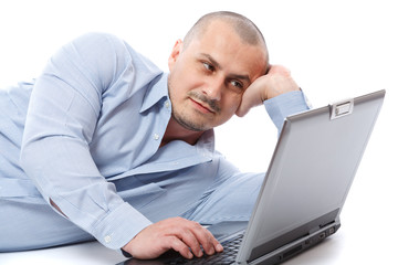 Relaxed businessman at his laptop