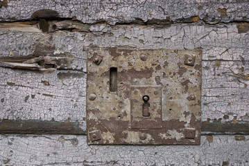 An old iron rusty door lock.