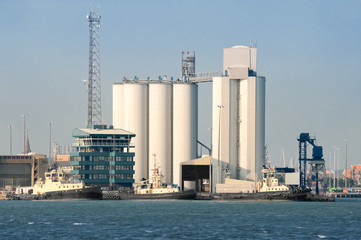 industrial port buildings and tug boats
