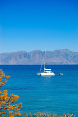 Fototapeta na wymiar Turquoise Aegean Sea and luxury yacht, Crete, Greece