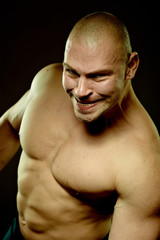 Emotional portrait of muscular aggressive man