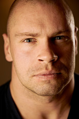 Closeup portrait of a serious handsome young man