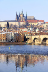 First Snow in Prague, gothic Castle with the Charles Bridge