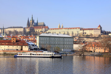 Fototapeta premium First Snow in Prague, gothic Castle above the River Vltava