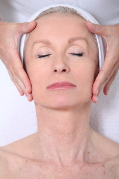 Closeup Of Senior Woman Having A Face Massage