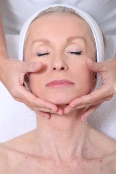 Closeup Of Senior Woman Having A Face Massage