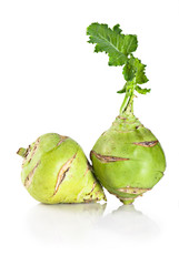 Kohlrabi cabbage with leaves over white background