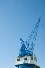 blue crane against blue skies
