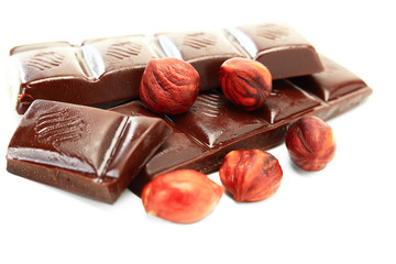 Dark chocolate and hazelnut on a white background