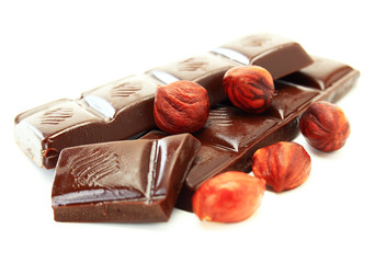 Dark chocolate and hazelnut on a white background