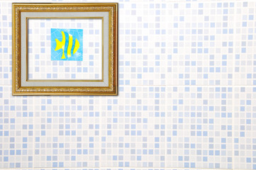 Gold Picture Frame on Ceramic Wall with fish sticker