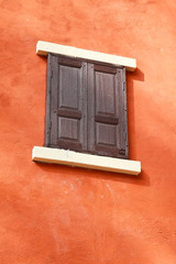 vintage wooden window on cement wall