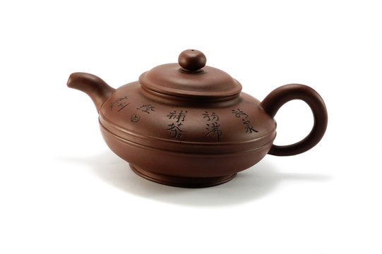 Vintage chinese brown teapot on white background