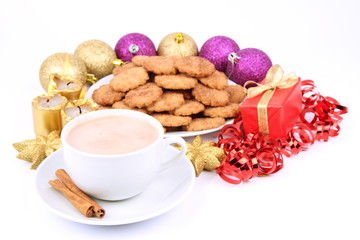 Cup of hot cocoa, cinnamon cookies and christmas decoration