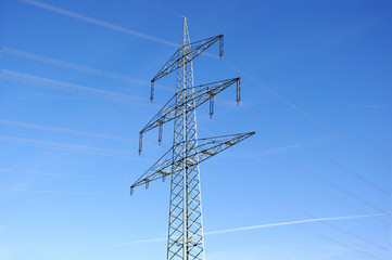 Electricity pylon against blue sky