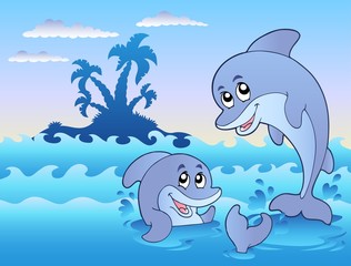 Zwei Delfine, die in Wellen spielen
