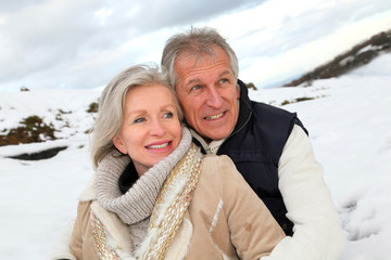 Portrait of happy senior couple at the mountain