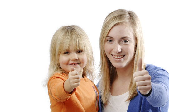 Teenage girl and toddler flash thumbs up