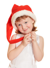 Portrait of pretty christmas girl in white dress and santa hat