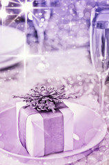 Obraz na płótnie Canvas Table setting with Christmas theme and gifts