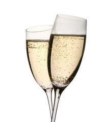 Two champagne glasses in toast