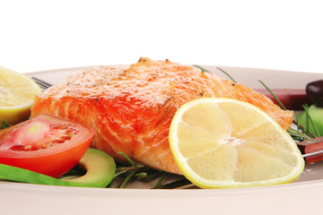 hot baked salmon piece served with vegetables