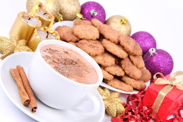 Cup of hot cocoa, cinnamon cookies and christmas decoration