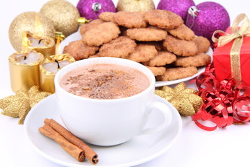 Cup of hot cocoa, cinnamon cookies and christmas decoration