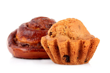 Loaf with raisins and muffin isolated on white